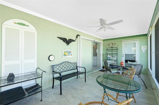 sunroom / solarium with ceiling fan