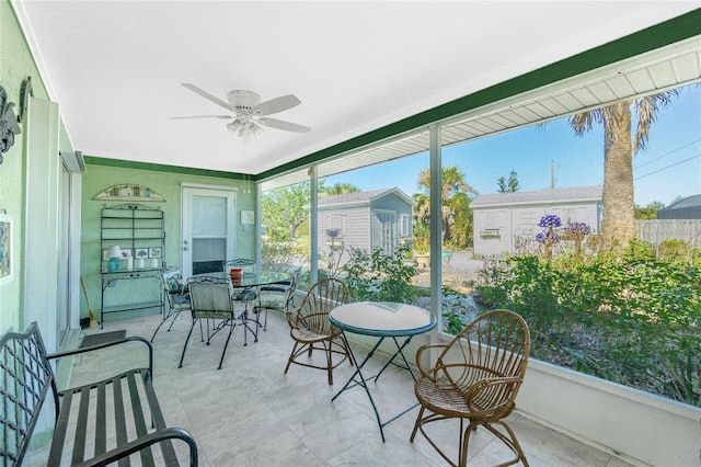 sunroom featuring plenty of natural light and ceiling fan