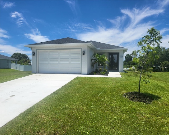 view of front facade featuring a front lawn and a garage