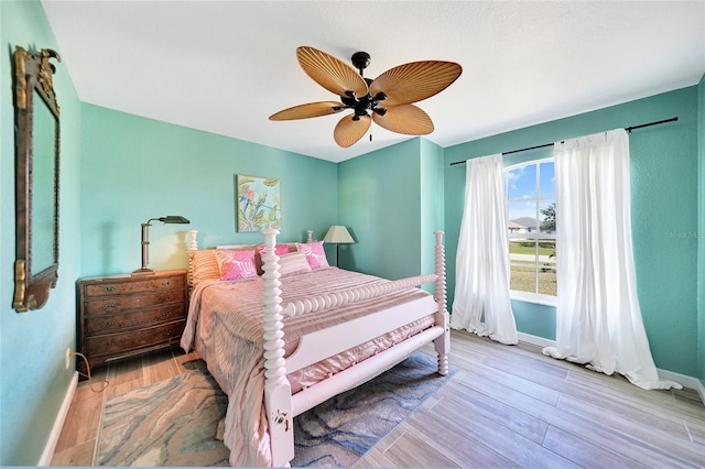 bedroom featuring ceiling fan and light wood-type flooring