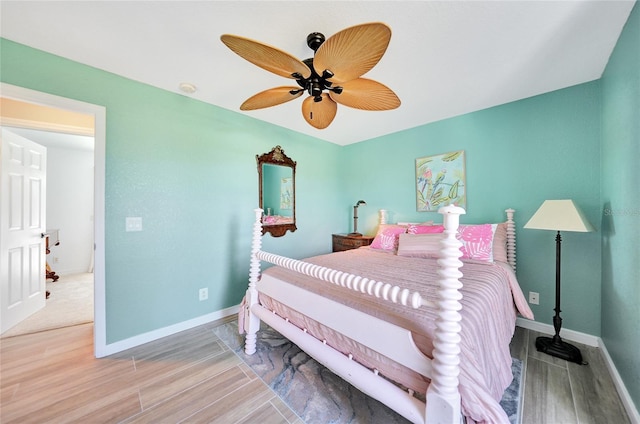 bedroom featuring wood-type flooring and ceiling fan