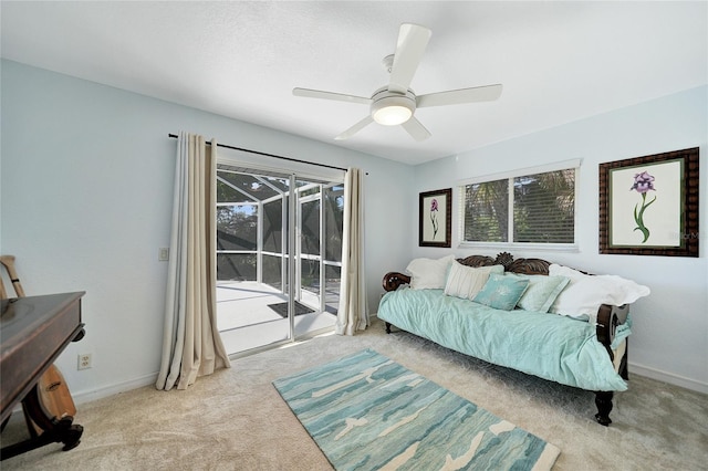 carpeted bedroom featuring ceiling fan and access to exterior