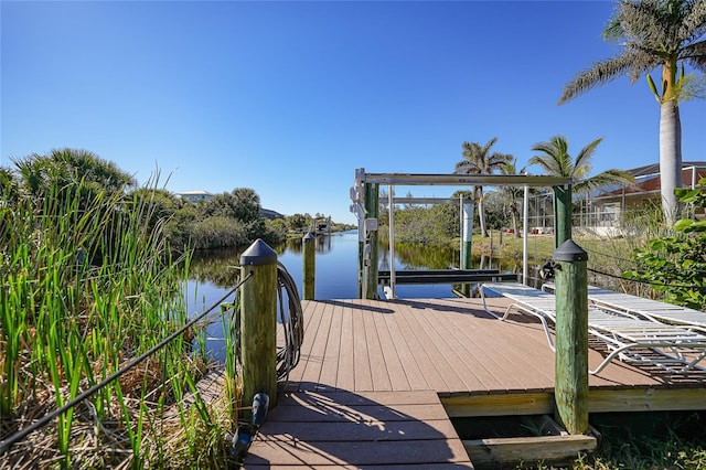 view of dock with a water view