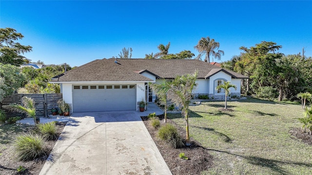 ranch-style house with a garage and a front lawn