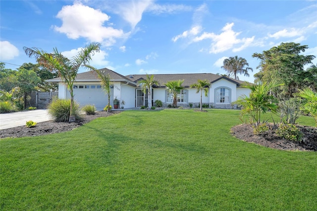 ranch-style house featuring a garage and a front yard