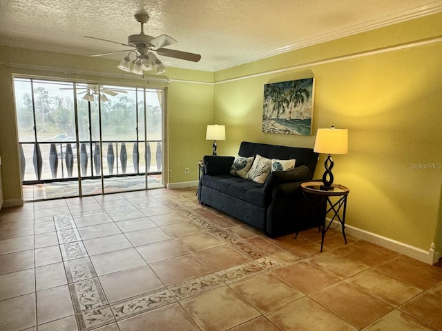 tiled living room with a textured ceiling, ceiling fan, and ornamental molding