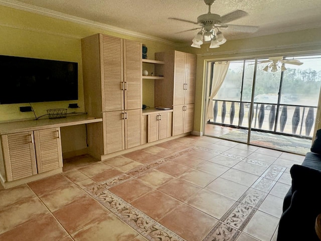 unfurnished living room with crown molding, light tile patterned floors, ceiling fan, and a textured ceiling