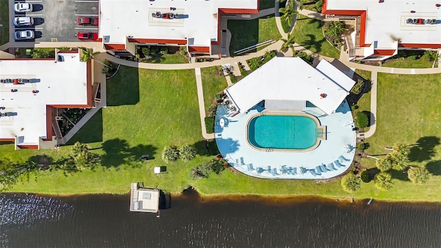 birds eye view of property featuring a water view