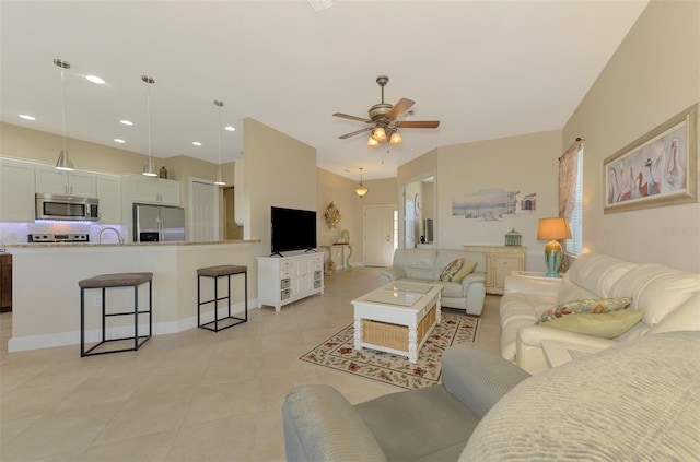 tiled living room with ceiling fan