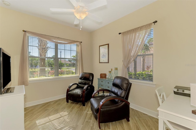 sitting room with light hardwood / wood-style flooring and ceiling fan