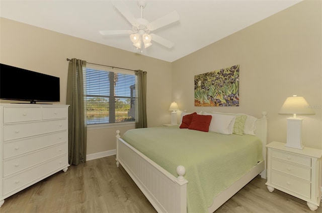 bedroom featuring light hardwood / wood-style floors and ceiling fan