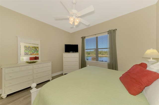 bedroom featuring light hardwood / wood-style flooring and ceiling fan