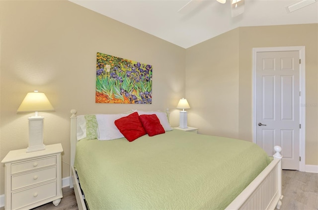 bedroom with ceiling fan and light hardwood / wood-style flooring