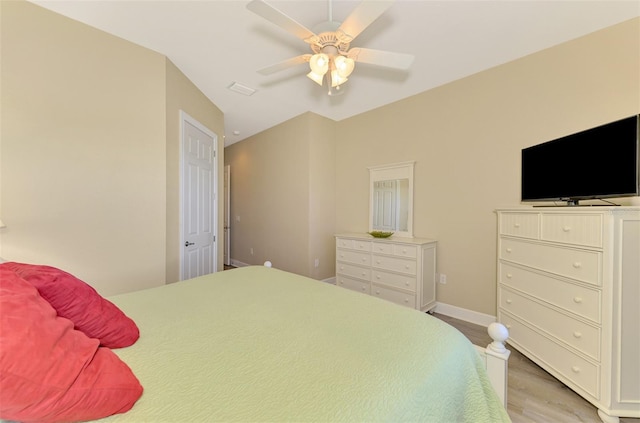 bedroom with ceiling fan and light hardwood / wood-style floors