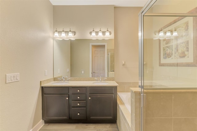 bathroom with vanity and plus walk in shower