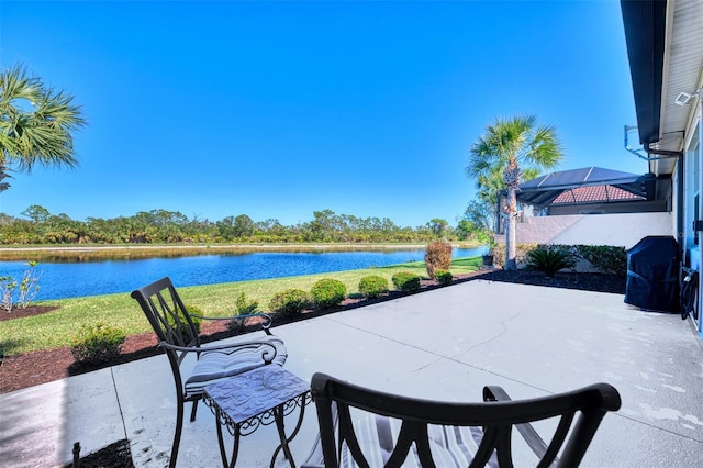 view of patio / terrace featuring area for grilling and a water view