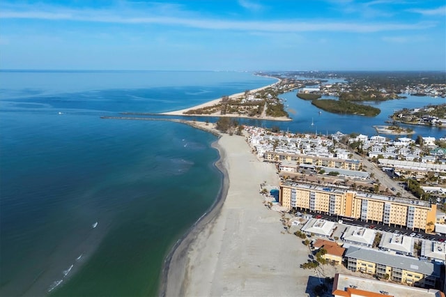 birds eye view of property featuring a water view and a beach view