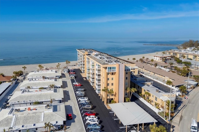 birds eye view of property with a beach view and a water view