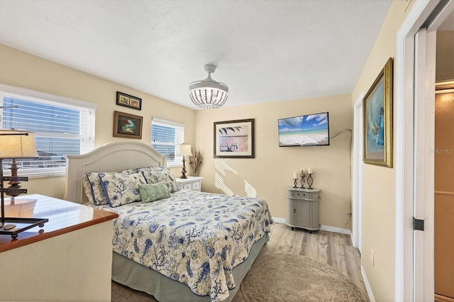 bedroom with light hardwood / wood-style flooring