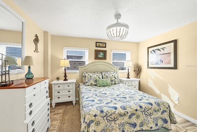 bedroom with light wood-type flooring