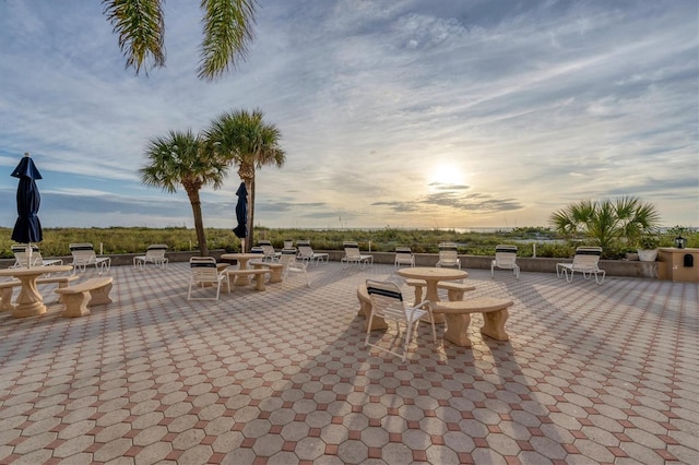 view of patio terrace at dusk