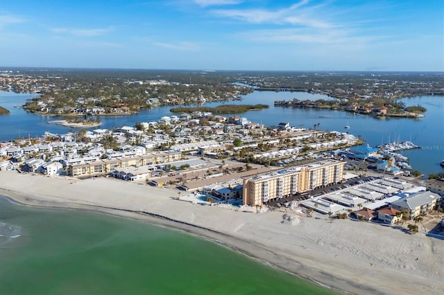 drone / aerial view featuring a view of the beach and a water view