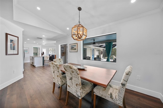 dining space with ceiling fan with notable chandelier, lofted ceiling, dark hardwood / wood-style flooring, and crown molding