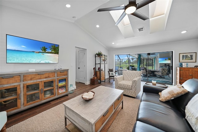 living room with dark hardwood / wood-style floors, ceiling fan, crown molding, and vaulted ceiling