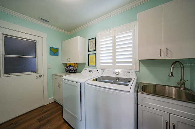 laundry area with cabinets, dark wood-type flooring, sink, crown molding, and washer and dryer