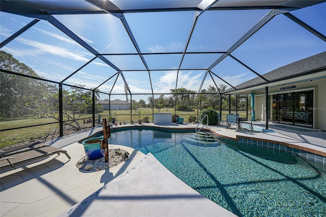 view of swimming pool with glass enclosure and a patio