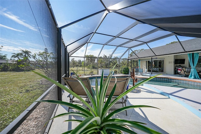 view of pool with a patio and a lanai