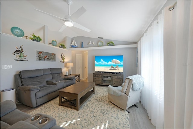 living room featuring light wood-type flooring, vaulted ceiling, and ceiling fan