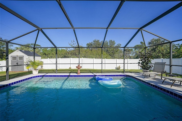 view of swimming pool featuring a patio area and a lanai