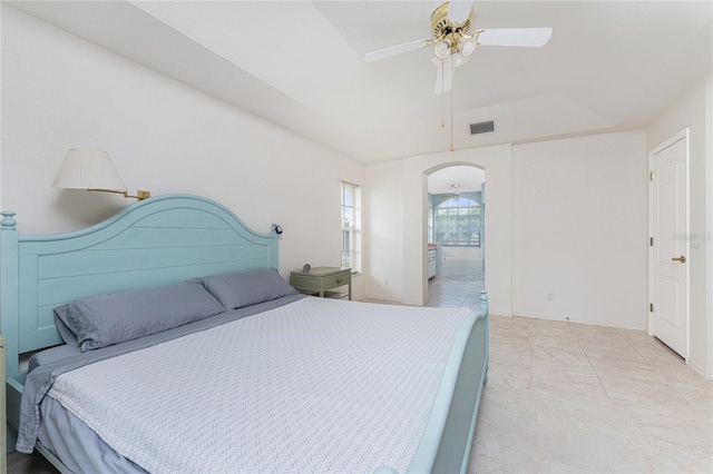 bedroom featuring connected bathroom and ceiling fan