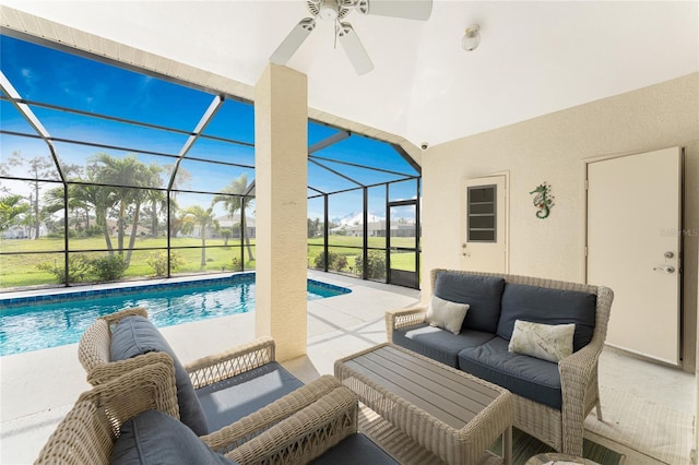 view of swimming pool featuring outdoor lounge area, a patio, and glass enclosure