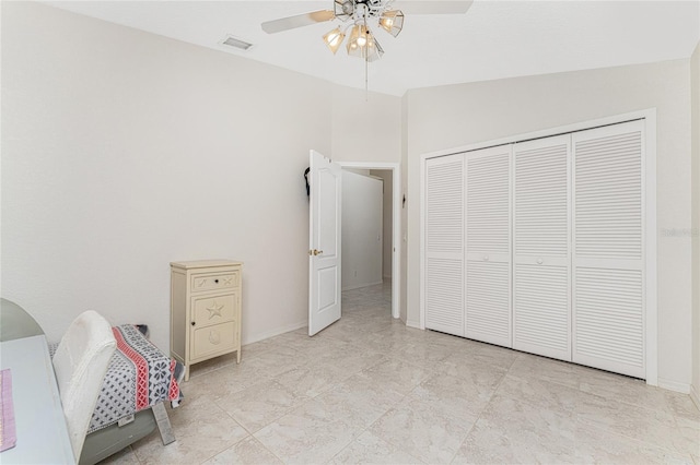 unfurnished bedroom featuring ceiling fan, a closet, and lofted ceiling