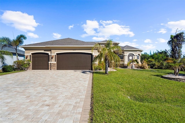 view of front of house with a front lawn and a garage