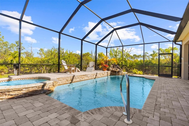 view of pool featuring an in ground hot tub, pool water feature, a patio area, and a lanai