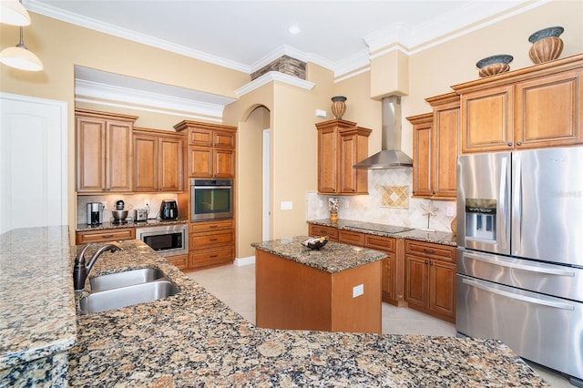 14010 San Domingo Blvd, Port Charlotte, FL 33981 - kitchen with appliances with stainless steel finishes, wall chimney exhaust hood, a sink, arched walkways, and a center island