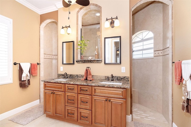 14010 San Domingo Blvd, Port Charlotte, FL 33981 - bathroom with a ceiling fan, walk in shower, double vanity, ornamental molding, and baseboards