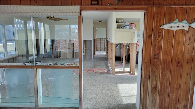 interior space with ceiling fan and carpet floors