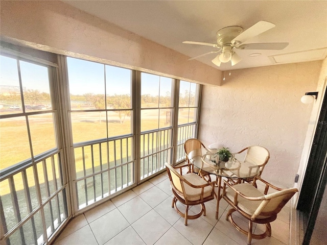 sunroom featuring ceiling fan