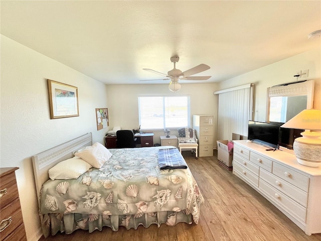 bedroom featuring ceiling fan and light wood-type flooring