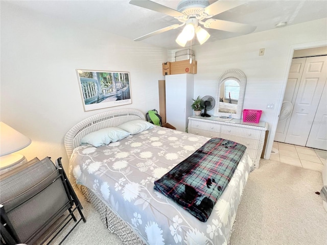 carpeted bedroom with a closet and ceiling fan