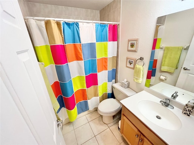 bathroom featuring tile patterned flooring, vanity, a shower with shower curtain, and toilet