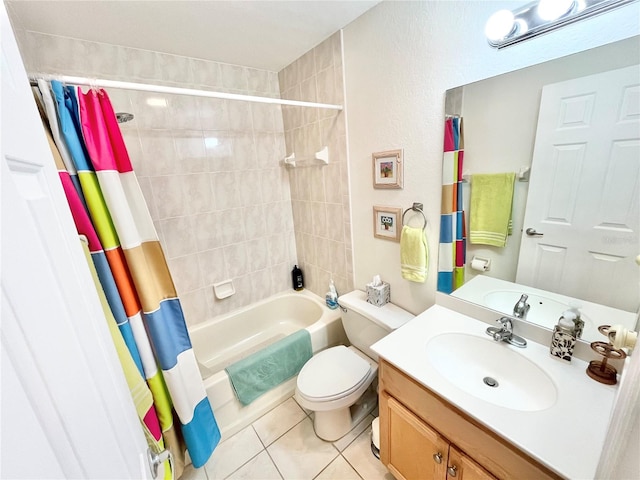 full bathroom featuring tile patterned floors, shower / bath combo with shower curtain, vanity, and toilet