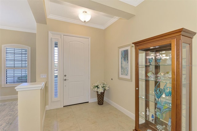 entrance foyer featuring ornamental molding