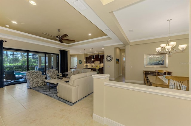 living room featuring ceiling fan with notable chandelier, light tile patterned floors, and crown molding