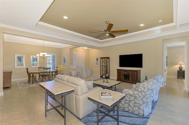 tiled living room with a tray ceiling, crown molding, and ceiling fan with notable chandelier