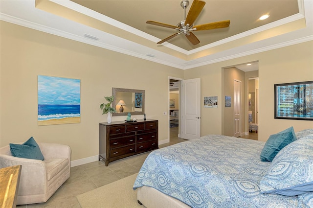 bedroom featuring a raised ceiling, ceiling fan, and crown molding